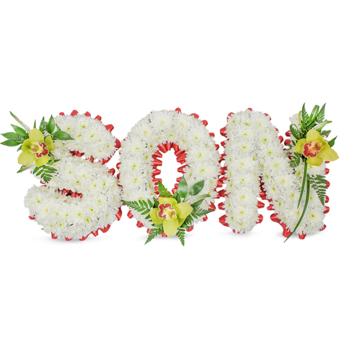 Careful, sculptural floral work forms the word SON, each letter built from thick clusters of small white chrysanthemums whose compact blooms create a soft, clouded volume and an even, velvety surface. The composition is framed by a bright red ribbon folded into a scalloped border that both defines and elevates the shapes; the ribbon's vivid colour cuts through the whiteness with a deliberate, comforting urgency that suggests love and remembrance. In three anchor positions the arrangement is enriched with lime-green Cymbidium orchids-one placed on the upper left of the S, one seated at the base of the O and one accenting the upper right of the N-each orchid showing a subtle orange to reddish-brown centre and a smooth, wax-like sheen that reflects the light differently from the chrysanthemums. Around the orchids, an assortment of long green leaves and delicate fern fronds unfurl, adding graceful vertical lines and a natural, restorative green that offsets the primary white-and-red palette. The plain white background keeps attention on the tactile contrasts: the chrysanthemums' soft density, the orchids' firm satin petals, the ribbon's crisp loops and the foliage's fresh gloss. Intended as a personalised funeral or memorial display, this tribute communicates a family's love for a son through measured craftsmanship and symbolic colour. It's the kind of arrangement a Willesden florist might lovingly prepare for a service at a nearby chapel or to be placed close to gravesites around Cricklewood and Walm Lane, where local knowledge of ceremonial floral traditions guides the balance between beauty and solemnity.